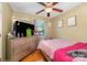 Bedroom featuring hardwood floors, and a dresser with lots of clutter at 1131 Laurel St, Salisbury, NC 28144