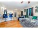 Stylish living space with hardwood floors, plush gray sofa, and an open layout connecting to the kitchen area at 1131 Laurel St, Salisbury, NC 28144