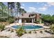 Beautiful backyard with a private pool, patio, and lush landscaping at 114 Misty Meadows Ct, Mooresville, NC 28117