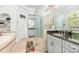 A bright bathroom featuring a glass shower, corner tub, and double vanity at 114 Misty Meadows Ct, Mooresville, NC 28117