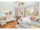 Well-lit bedroom with vaulted ceiling, matching furniture, and hardwood floors at 114 Misty Meadows Ct, Mooresville, NC 28117