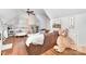 Bonus Room with hardwood floors, leather sofa and natural light at 114 Misty Meadows Ct, Mooresville, NC 28117