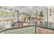 Kitchen view with stainless appliances, lots of natural light and hardwood floors at 114 Misty Meadows Ct, Mooresville, NC 28117