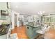 Eat-in kitchen with stainless appliances, hardwood floors, island bar and lots of cabinetry at 114 Misty Meadows Ct, Mooresville, NC 28117