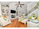 Spacious living room with fireplace, hardwood floors, and built-in bookshelves at 114 Misty Meadows Ct, Mooresville, NC 28117