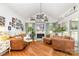 Inviting living room features a fireplace, hardwood floors, and lots of natural light at 114 Misty Meadows Ct, Mooresville, NC 28117