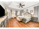 Spacious main bedroom boasts hardwood floors, a tray ceiling, and lots of natural light at 114 Misty Meadows Ct, Mooresville, NC 28117