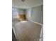Neutral bedroom with tiled floors and a window view at 116 Morning Glory Ave, Belmont, NC 28012