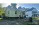 Charming single-Gathering home featuring a covered front porch and quaint architectural details at 116 Morning Glory Ave, Belmont, NC 28012
