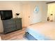 Bedroom with dark wood dresser and view of the en-suite bath at 11824 Larkridge Ct, Charlotte, NC 28226
