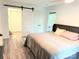 Inviting bedroom with sliding barn door and natural light at 11824 Larkridge Ct, Charlotte, NC 28226