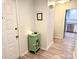 Hallway with a view of the kitchen and sleek, modern flooring at 11824 Larkridge Ct, Charlotte, NC 28226