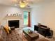 Bright living room with fireplace and large windows at 11824 Larkridge Ct, Charlotte, NC 28226