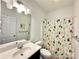 Bathroom with modern vanity, large mirror, and a shower with decorative cacti curtain at 12421 Fiorentina St, Charlotte, NC 28277