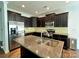 Beautiful kitchen with granite countertops, stainless steel appliances, and dark wood cabinets at 12421 Fiorentina St, Charlotte, NC 28277