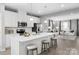 Bright, open kitchen with island, white cabinetry, and stainless steel appliances at 1344 Holden Sw Ave, Concord, NC 28025