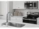 Modern kitchen with quartz countertops, stainless steel appliances and white cabinets at 1358 Holden Sw Ave, Concord, NC 28025