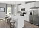 Stylish kitchen with white cabinets, stainless appliances, and a center island with barstool seating at 1358 Holden Sw Ave, Concord, NC 28025