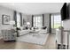 Inviting living room with plush sofas, neutral decor, and ample natural light from large windows at 1358 Holden Sw Ave, Concord, NC 28025