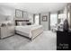 Serene primary bedroom with a king bed, soft lighting, and coordinated furnishings at 1358 Holden Sw Ave, Concord, NC 28025