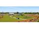 Large playground with slides, swings, and climbing structures, set in a green lawn with picnic areas and a recreational building at 1358 Holden Sw Ave, Concord, NC 28025