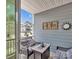 Cozy balcony featuring cushioned wicker seating, with views of neighboring townhomes at 138 Marron Dr # 25, Indian Trail, NC 28079