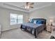 Comfortable bedroom features a tray ceiling, plush carpeting, and a large window at 138 Marron Dr # 25, Indian Trail, NC 28079