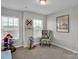 Bright bedroom features natural light, neutral color palette and a comfortable chair at 138 Marron Dr # 25, Indian Trail, NC 28079