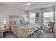 Tranquil bedroom featuring a rustic bed frame, soft carpet, and ample natural light at 138 Marron Dr # 25, Indian Trail, NC 28079