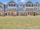 Charming townhomes featuring colorful exteriors, brick accents, and well-maintained landscaping offer curb appeal at 138 Marron Dr # 25, Indian Trail, NC 28079