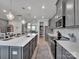 Open concept kitchen with gray cabinets, a large island, and seamless flow to living spaces at 138 Marron Dr # 25, Indian Trail, NC 28079