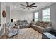 Comfortable living room with gray reclining sofas, a ceiling fan, and stylish decor at 138 Marron Dr # 25, Indian Trail, NC 28079