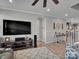 Cozy living room featuring wood floors, a ceiling fan, modern decor, and ample natural light at 138 Marron Dr # 25, Indian Trail, NC 28079
