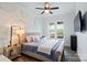 Comfortable bedroom with a large bed and unique bubble wall art at 140 Sisters Cove Ct, Mooresville, NC 28117