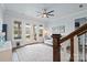 Bonus room features a ceiling fan and glass patio doors at 140 Sisters Cove Ct, Mooresville, NC 28117