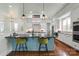 Stylish kitchen featuring an island with seating, modern appliances, and granite countertops, perfect for cooking and entertaining at 140 Sisters Cove Ct, Mooresville, NC 28117
