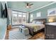 Serene main bedroom with water view, offering a relaxing retreat with natural light and ample space at 140 Sisters Cove Ct, Mooresville, NC 28117
