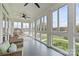 Sunroom featuring hardwood floors, ceiling fan, and bright daylight at 140 Sisters Cove Ct, Mooresville, NC 28117
