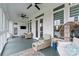 Bright porch with seating, ceiling fans, and scenic views at 140 Sisters Cove Ct, Mooresville, NC 28117