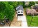 Aerial view of the home featuring a new driveway and proximity to mature trees at 1413 Hateras Ave, Charlotte, NC 28216