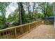 Spacious back deck offering serene views of the surrounding lush greenery and neighborhood at 1413 Hateras Ave, Charlotte, NC 28216