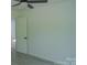 A bedroom featuring light gray floors and a ceiling fan at 1413 Hateras Ave, Charlotte, NC 28216
