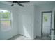 Bright bedroom with a ceiling fan, closet, and an entrance to a connected room at 1413 Hateras Ave, Charlotte, NC 28216