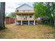 Rear exterior shows spacious home with a large yard, perfect for outdoor enjoyment at 1413 Hateras Ave, Charlotte, NC 28216