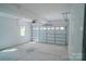 Spacious garage with white walls and floors at 1413 Hateras Ave, Charlotte, NC 28216