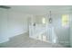 A light and bright hallway featuring modern fixtures and ample space at 1413 Hateras Ave, Charlotte, NC 28216