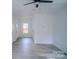 Bright living room featuring modern ceiling fan, recessed lighting, and gray wood-look flooring at 1413 Hateras Ave, Charlotte, NC 28216
