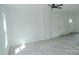 Bright living room with gray wood-look floors, featuring natural light from a window at 1413 Hateras Ave, Charlotte, NC 28216