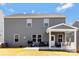 Backyard showing a covered patio, grill and seating in a fenced yard at 14224 Canemeadow Dr, Charlotte, NC 28278
