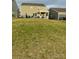 Spacious backyard with a covered patio, perfect for outdoor entertaining and enjoying the green space at 14224 Canemeadow Dr, Charlotte, NC 28278